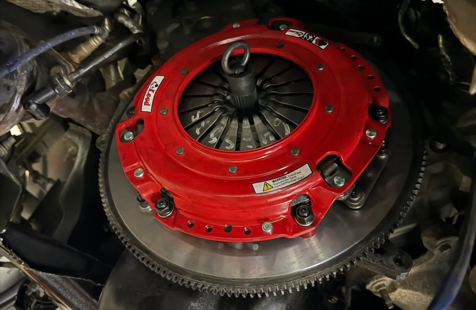 Background image of an automotive clutch assembly